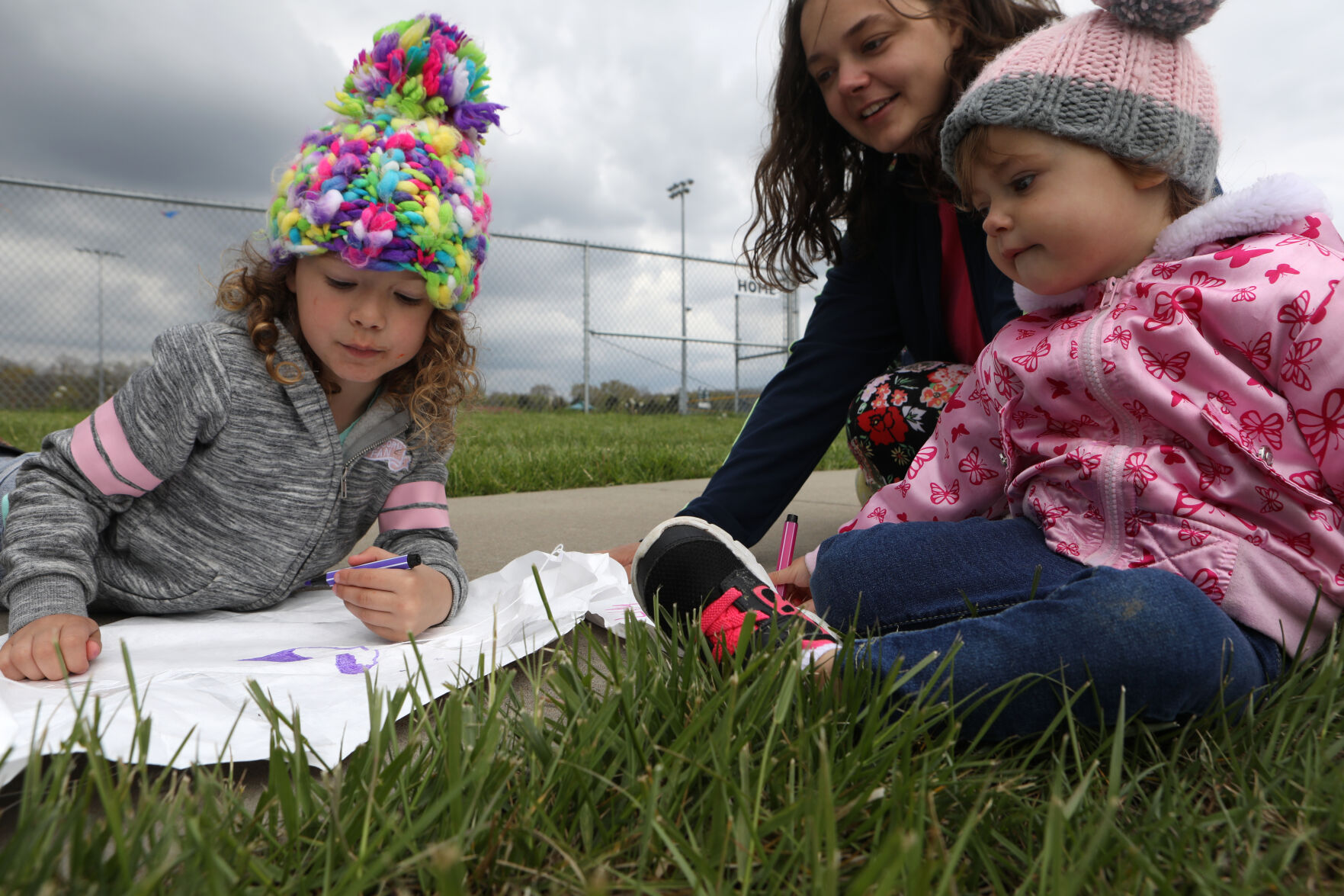 Adelynn and Liliana color a kite